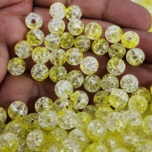 Akrüülpärlid 11 mm ca 50 tk  kollased mõra efektiga tahuline